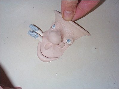  facemug being dipped in glaze 